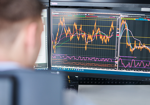 Hand gesturing at a computer screen.